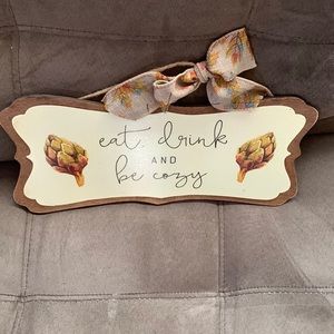 Sign.  Eat, drink & be cozy